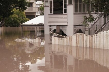 Floodwater rising around a Queenslander home during the 2011 floods.